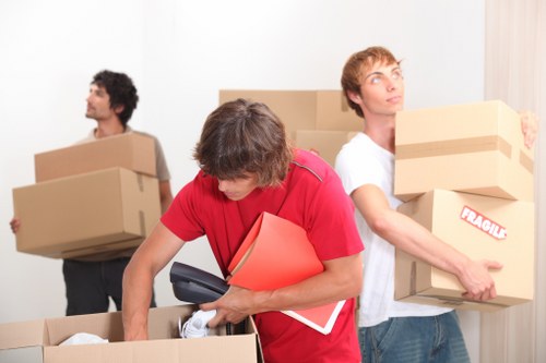 Moving boxes and furniture prepared for transport in Wimbledon