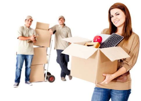 Moving crew handling office relocation items in a Wimbledon property