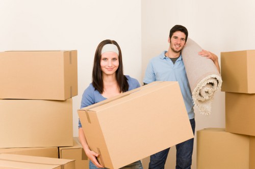 Professional movers handling furniture in a Wimbledon flat move
