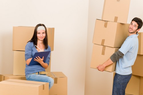 Local movers arranging boxes for delivery in Wimbledon