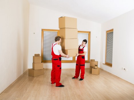 Office furniture and boxes being loaded for a local business relocation